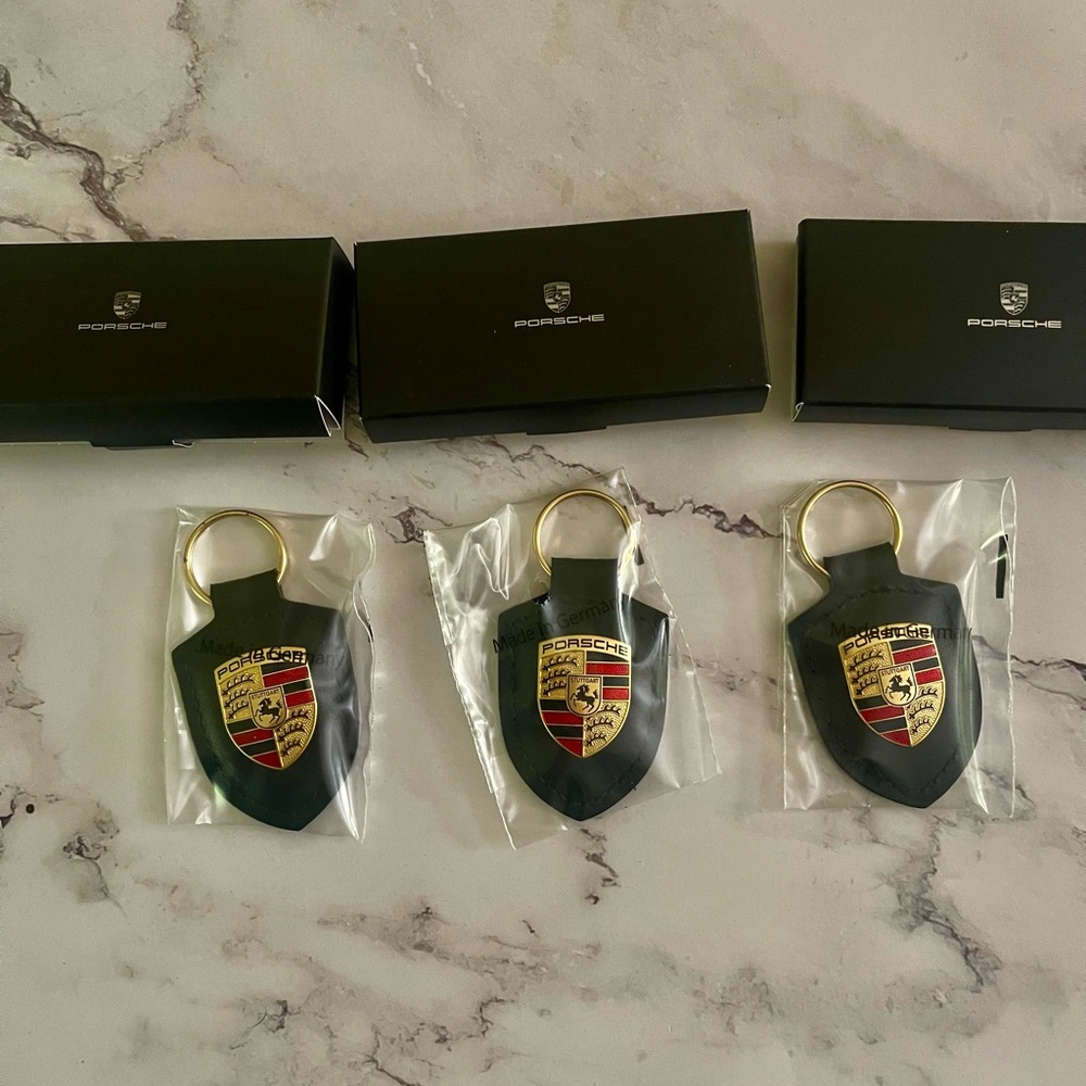 Genuine Porsche Design Black and Gold Emblem Leather Keychain New